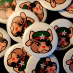 Stack of Pig Salute Buttons